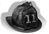 Image of fire chief's old leather helmet from the 19th century.