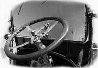 A wooden steering wheel image of a vintage 1919 Stutz fire truck